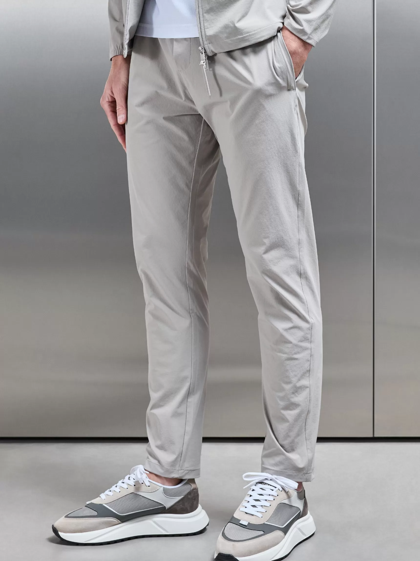 Shop ARNE Active Technical Tapered Trackpant - Stone